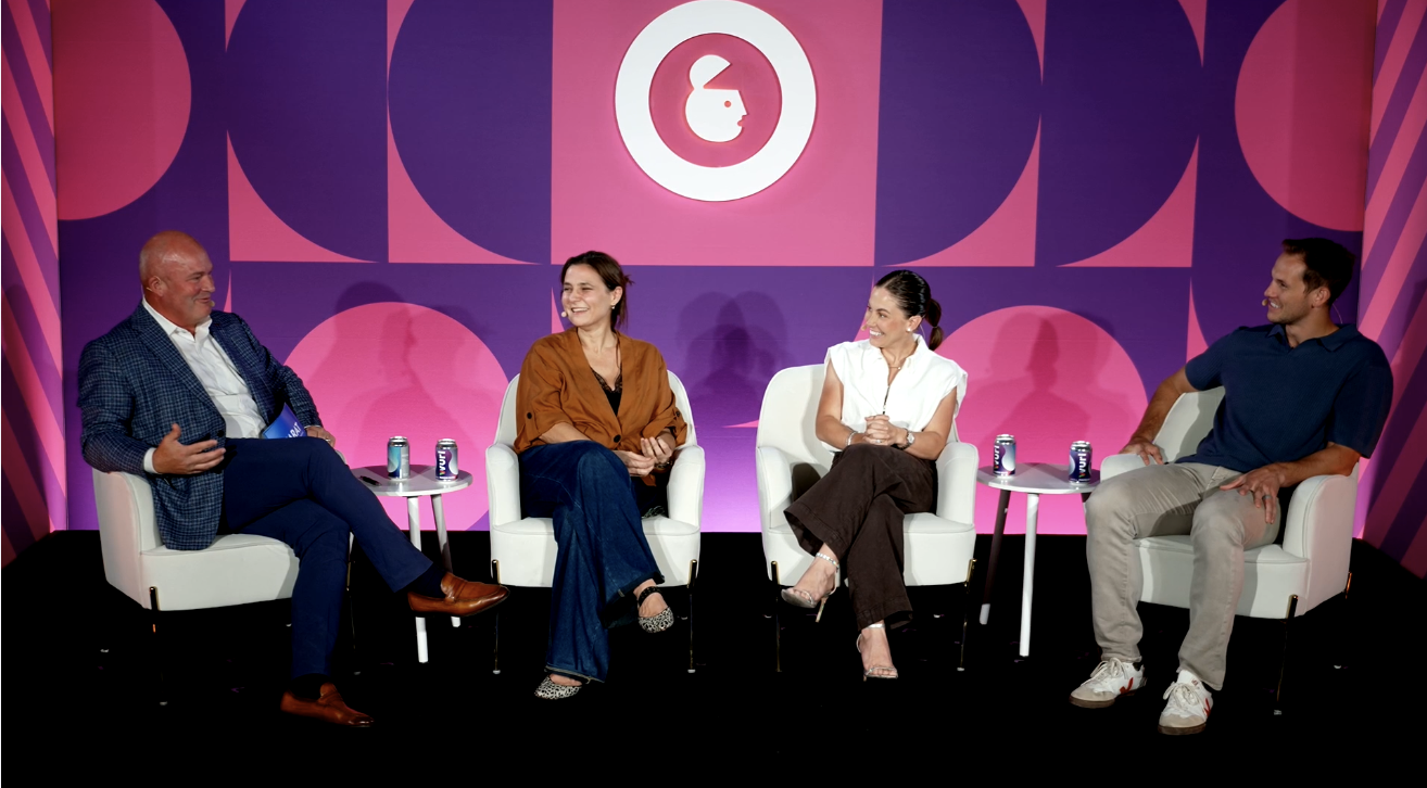A photo of four panelists speaking on stage at Carat's session at Advertising Week New York 